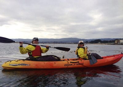 Two people kayaking together